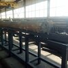 Транспортер продольный для бревен с толкателем